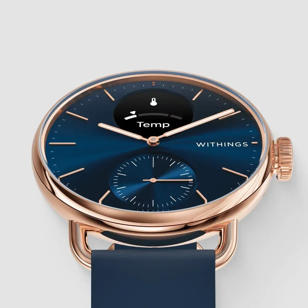 Zegarek Withings z niebieską tarczą i złotą obudową, wyświetlacz temperatury, idealny do home office